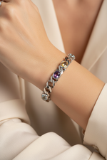 14k white gold oval-cut multi-colored gemstone bracelet with 6.0 cts.tw, worn on a model, showcasing vibrant gemstones and elegant design.