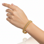 14k yellow gold diamond tennis bracelet with 2.99 carats total weight, worn on a model, showcasing elegant jewelry design