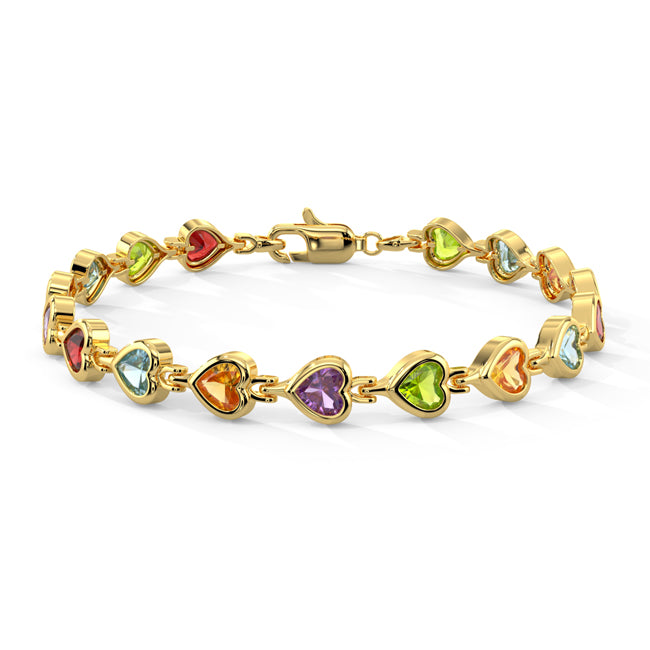 Gold bracelet with heart-shaped gemstones on a white background