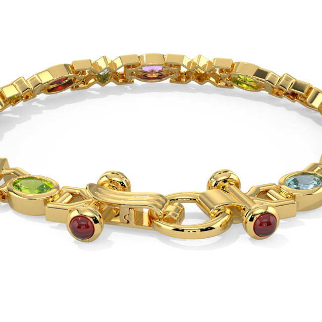 Gold bracelet with gemstones on a white background