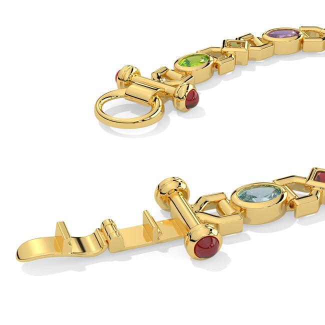Gold bracelet with gemstones on a white background