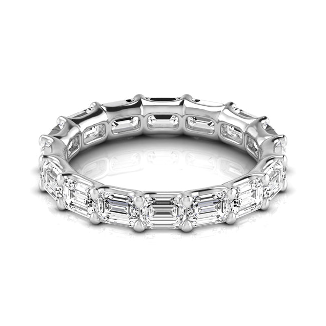 White gold eternity ring featuring a continuous row of baguette-cut clear gemstones, shown on a clean white background with a subtle reflection.