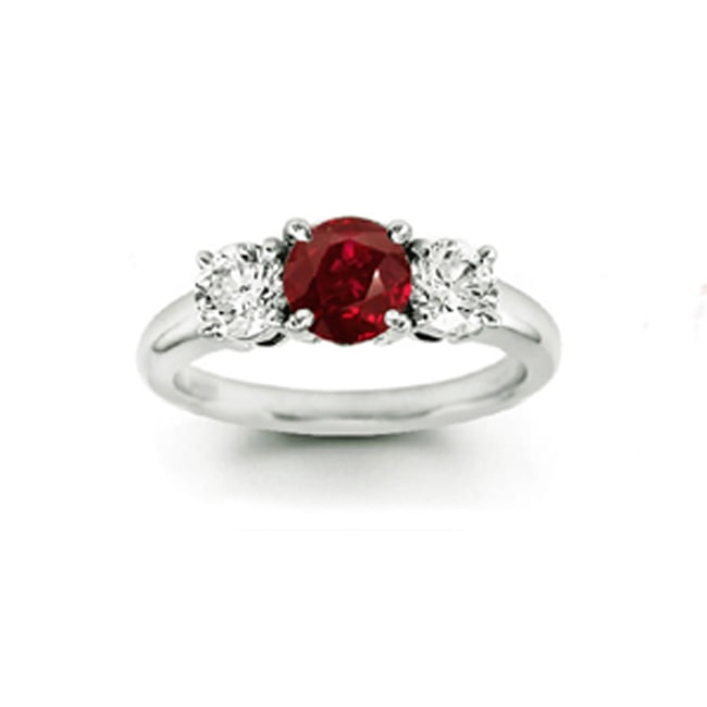 Silver ring with a red gemstone and two smaller diamonds on a white background