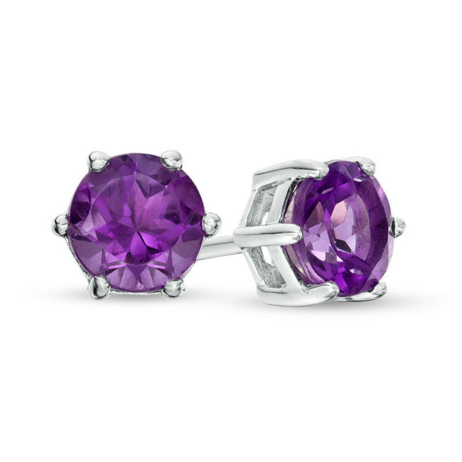 Pair of purple gemstone stud earrings on a white background