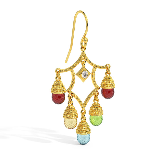 Gold earrings with colored gemstones on a white background