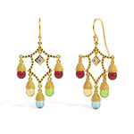 Gold chandelier earrings with colorful beads on a white background