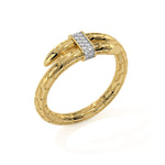Gold spear ring with a diamond clasp on a white background