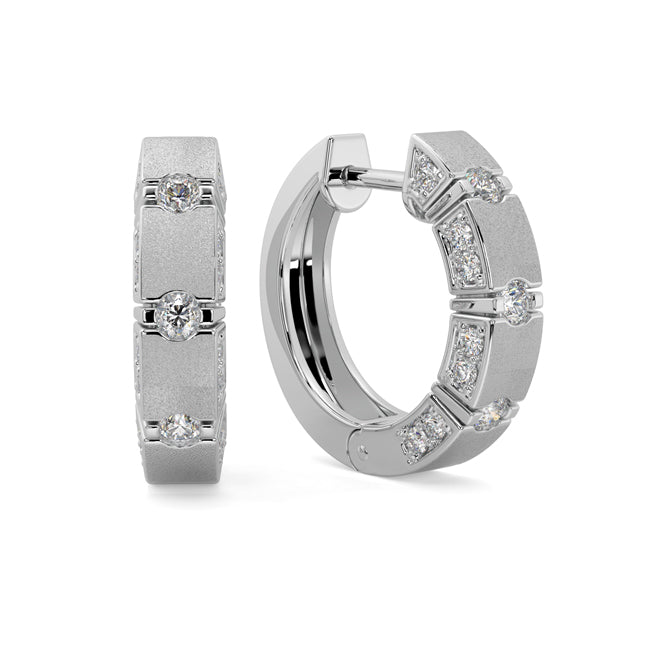 Gold hoop earrings with diamond accents on a white background