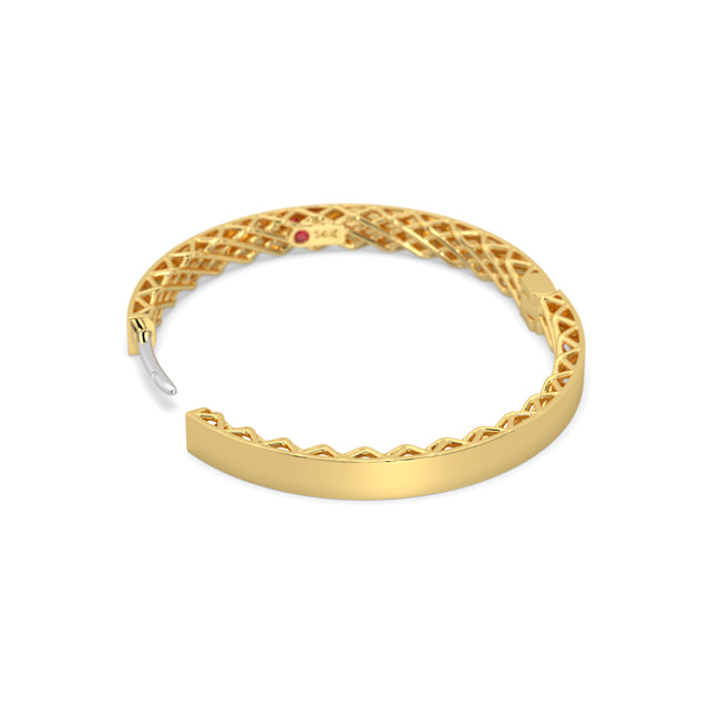 Gold hoop with intricate design on a white background