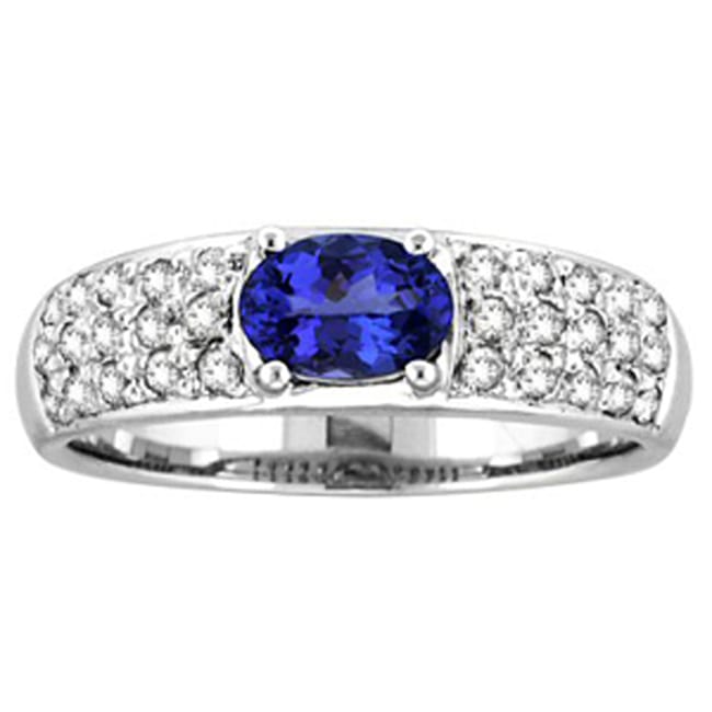 14k gold oval cut tanzanite and diamond fashion ring with 1.75 carats total weight, featuring a stunning gemstone centerpiece.