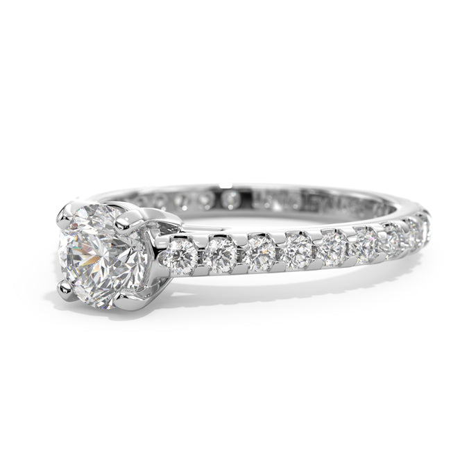 Diamond ring with a central gemstone and smaller stones on a white background