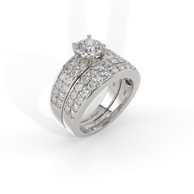 Gold bridal set rings with diamond accents on a white background