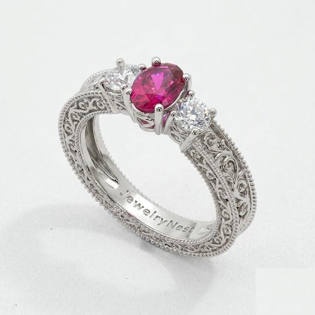 14K white gold oval ruby and diamond fashion ring with 1.50 carats total weight, featuring elegant gemstone accents.