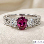 14K white gold oval ruby and diamond fashion ring with 1.50 total carats, featuring vibrant rubies and sparkling diamonds.