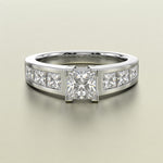 A gold diamond ring featuring a central princess-cut diamond surrounded by a halo of smaller round diamonds on a sleek band, set against a neutral light beige background.
