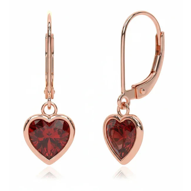 Heart-shaped garnet dangle earrings in 14k gold with 1.84 carats total weight, featuring elegant design and sparkling gemstone details.