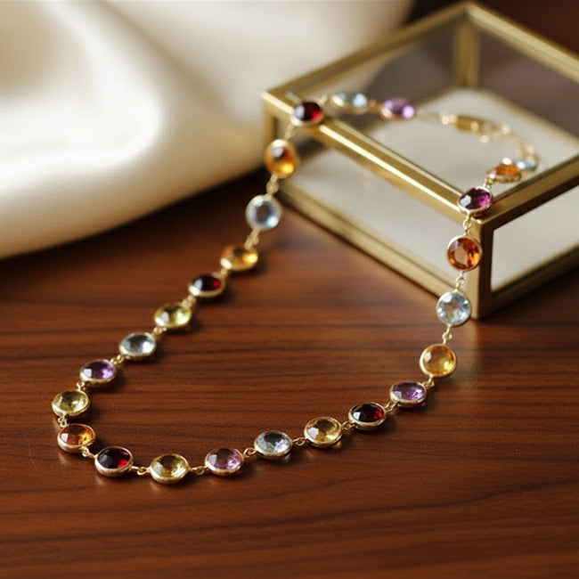 Necklace with multicolored gemstones on a wooden surface