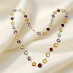 Necklace with multicolored gemstones on a soft beige background