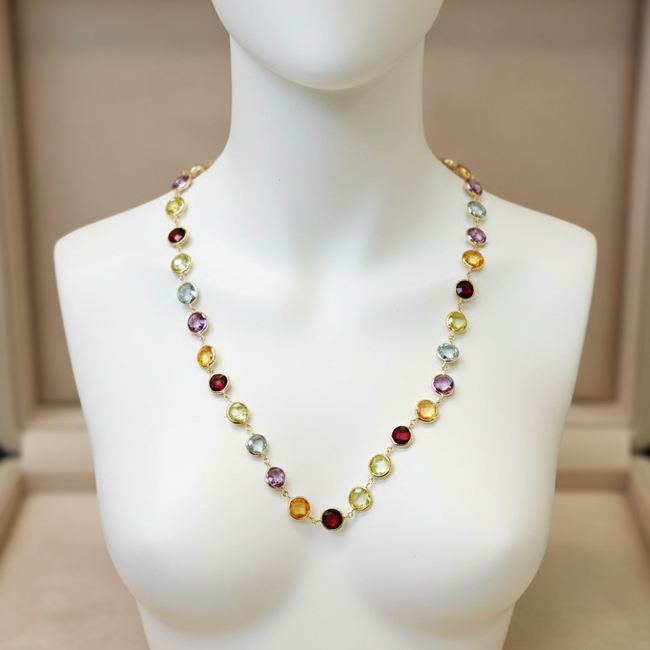 Multicolored beaded necklace on a mannequin against a neutral background