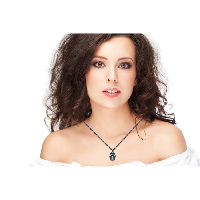 Woman wearing a necklace on a white background