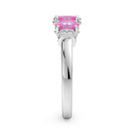 Silver ring with a pink gemstone on a white background
