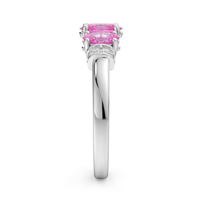 Silver ring with a pink gemstone on a white background
