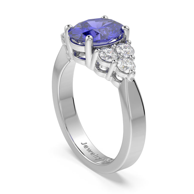Gold ring with a purple gemstone and diamond accents on a white background
