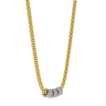 A gold chain necklace with three small cylindrical beads at the center, two of which are paved with clear stones and one is plain gold, shown on a white background.