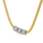 A gold chain necklace featuring three cylindrical silver-toned beads, each paved with small clear stones, set against a plain white background.