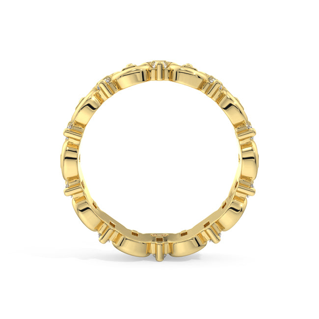 A yellow gold eternity ring featuring a continuous channel setting of small round-cut diamonds, shown from a top-down perspective on a clean white background.