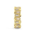 A yellow gold link ring featuring a series of baguette-cut clear gemstones set into curved, interlocking links, shown on a plain white background.