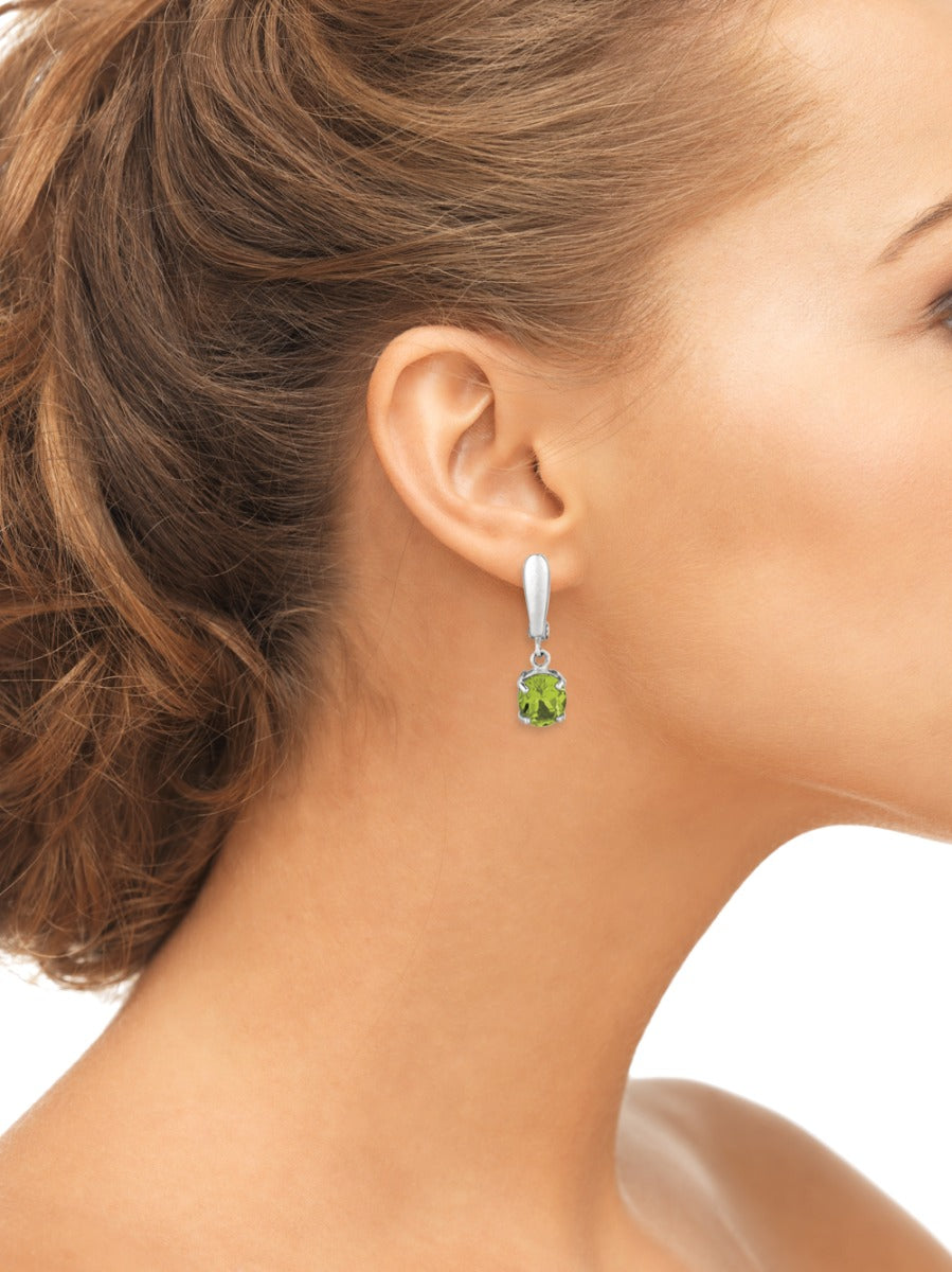 Sterling Silver Oval Peridot Dangle Earrings On Woman Ear (3.20.cts.tw)