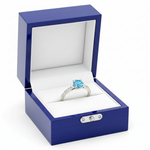 14k white gold aqua blue solitaire diamond fashion ring with 0.65 ct tw in a royal blue wooden box.