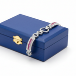 Art Deco pink sapphire bracelet on royal blue wooden box