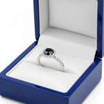 14k gold black solitaire diamond fashion ring with 0.65 ct total weight, displayed in a royal blue wooden box.