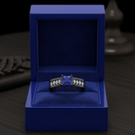 14k black gold fashion ring featuring a square tanzanite and diamond accents, displayed in a gift box.