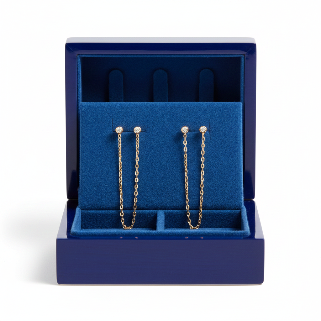 Diamond chain earrings in royal blue wooden box