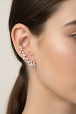 Diamond cluster crawler earrings on model
