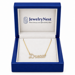 Diamond Dream script name necklace displayed in an open royal-blue wooden JewelryNest box