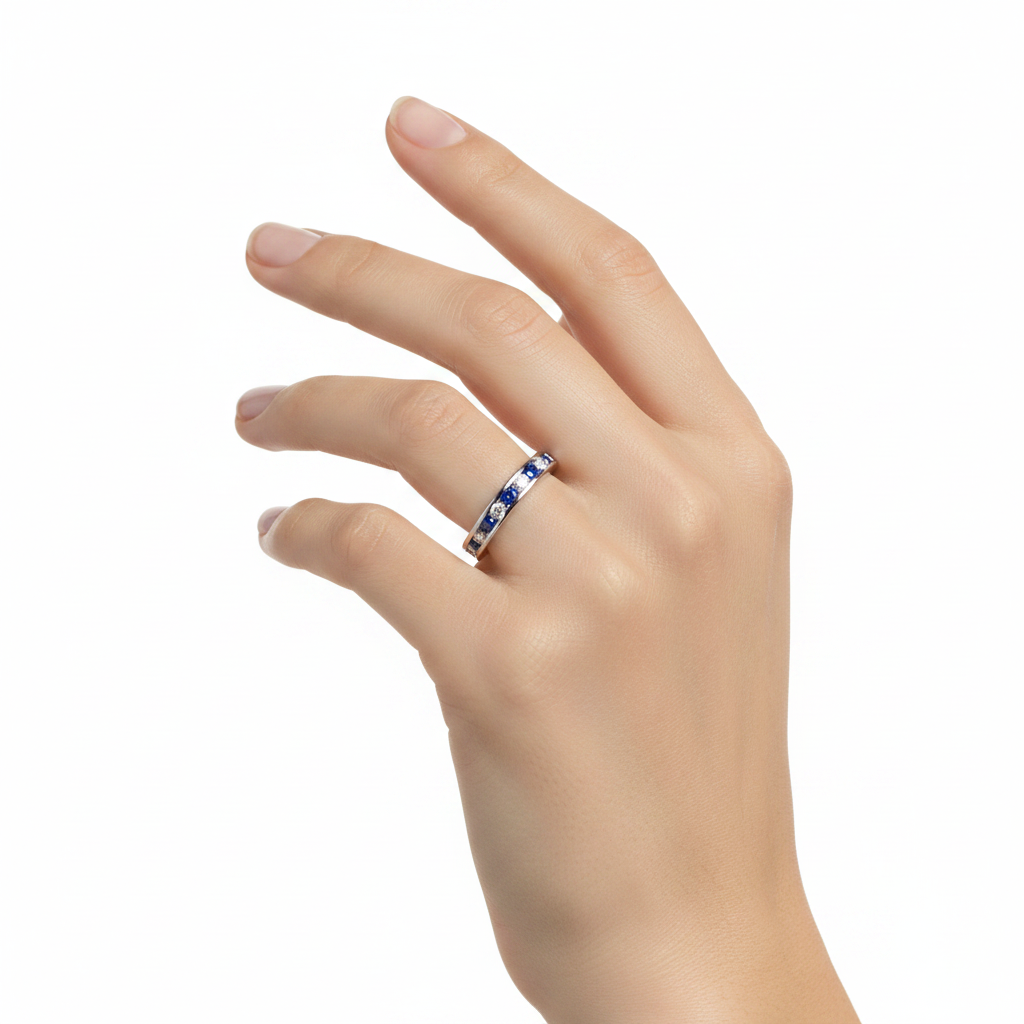 14k gold diamond and sapphire eternity wedding band with 1.56 carats total on a model, showcasing elegant jewelry design.