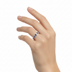 14k gold diamond and sapphire eternity wedding band with 1.56 carats total on a model, showcasing elegant jewelry design.