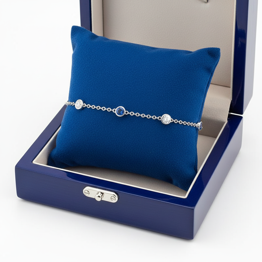 Diamond sapphire station bracelet on royal blue wooden box