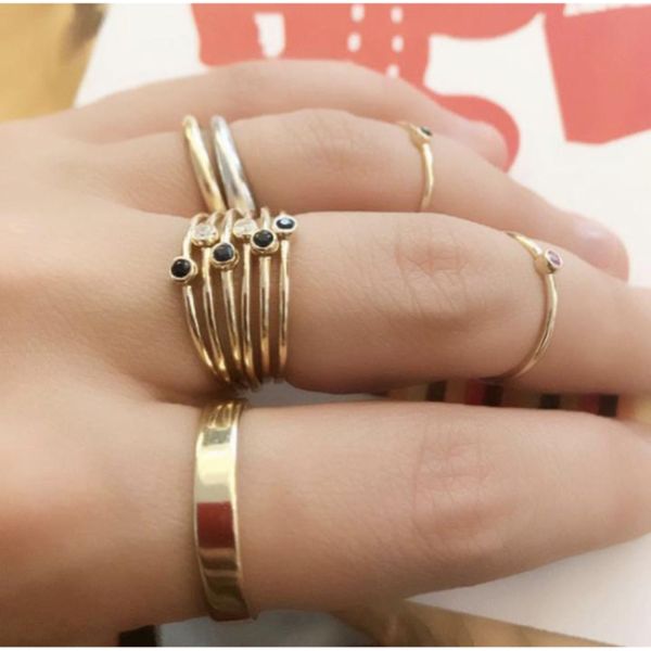 14k Rose Gold Single Diamond Solitaire Stackable Ring On Woman Hand (0.03 ct.tw)