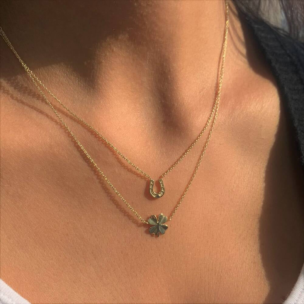 14K Yellow Gold Horseshoe And Irish Clover Multi-Strand Necklace On Woman Neck (3.5.gr.tw)
