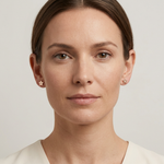 Full-face model wearing the rose-gold diamond star studs