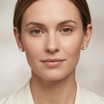 Full-face model wearing yellow-gold princess-cut diamond studs