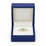 14k gold octagon geometric solitaire ring with 0.20 ct tw diamond, displayed in a royal blue wooden box.