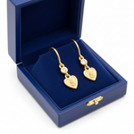 Heart cherub diamond earrings in blue box