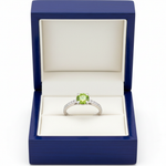 14k white gold ice green diamond solitaire fashion ring with 0.65 ct tw in a royal blue wooden box.