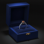 14k gold orange cognac solitaire diamond ring with 0.65 carats total weight, featuring a prominent central diamond and elegant band.